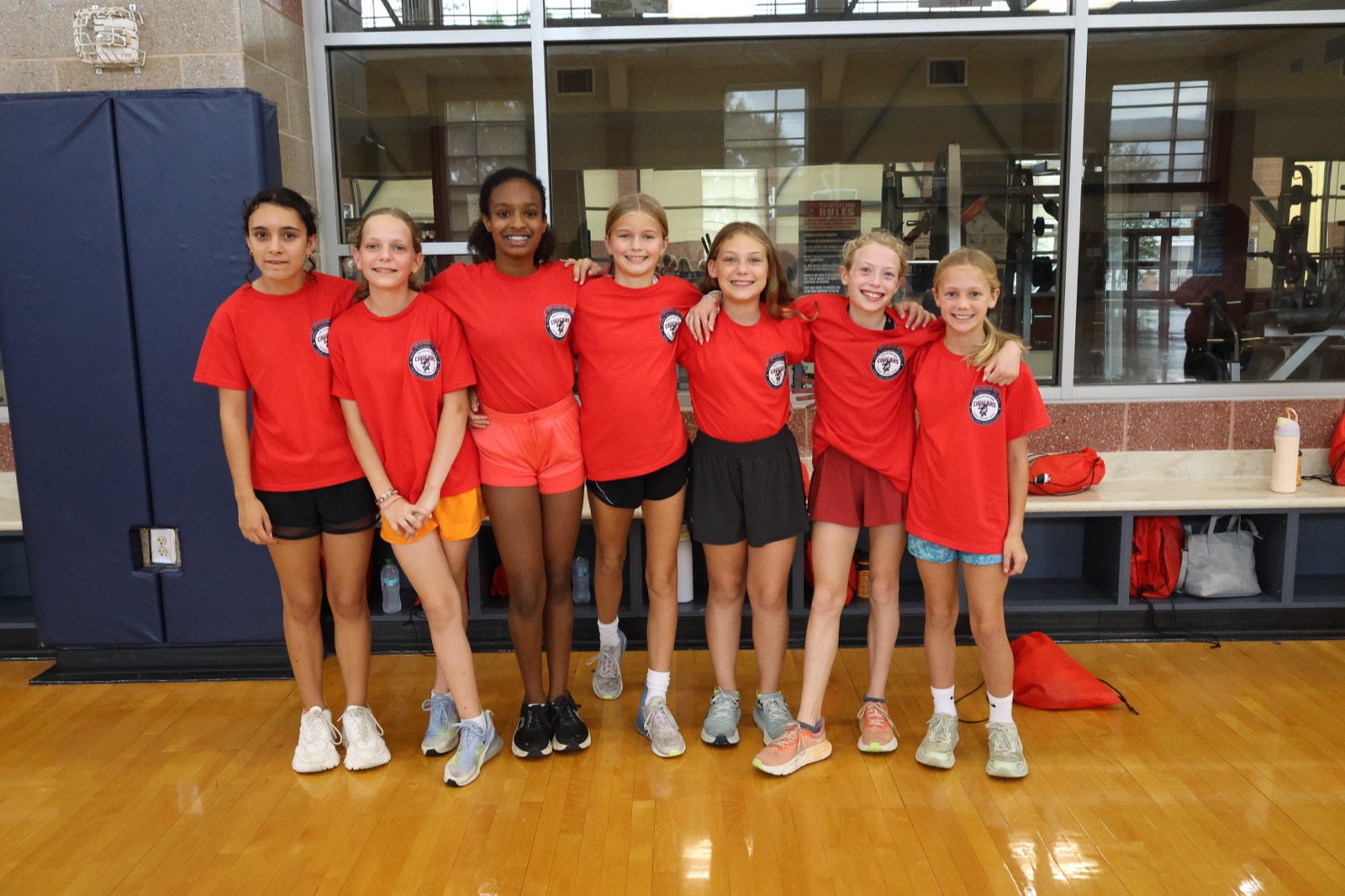 Girls in the Game cheerleading clinic participants in Cougars T-shirts at the CSU Student Recreation Center