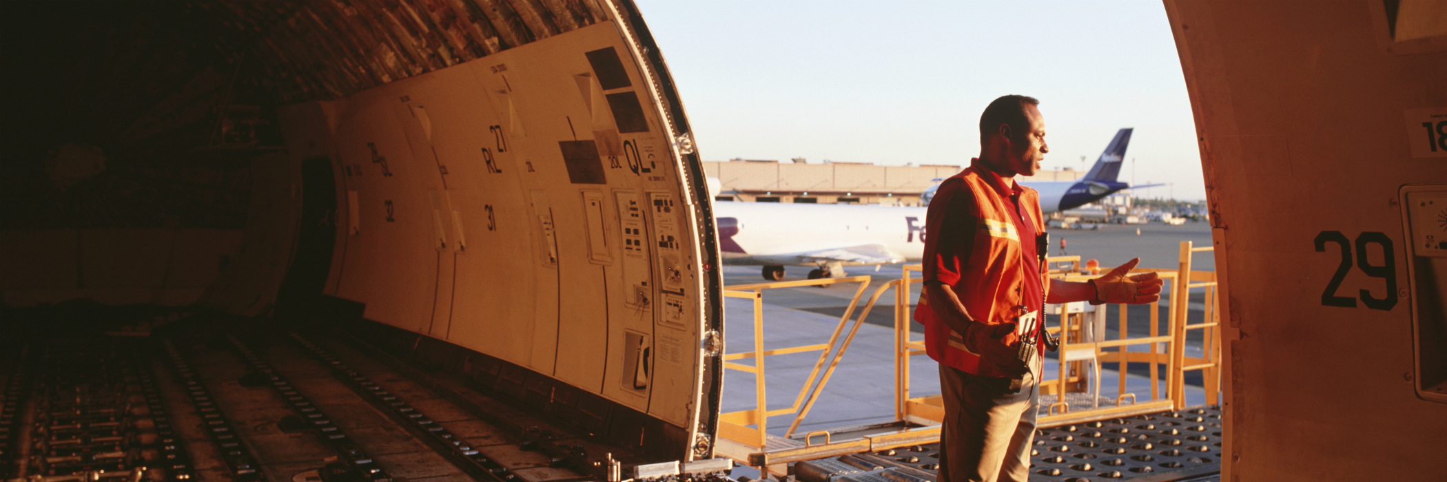 Cargo employee and empty cargo plane