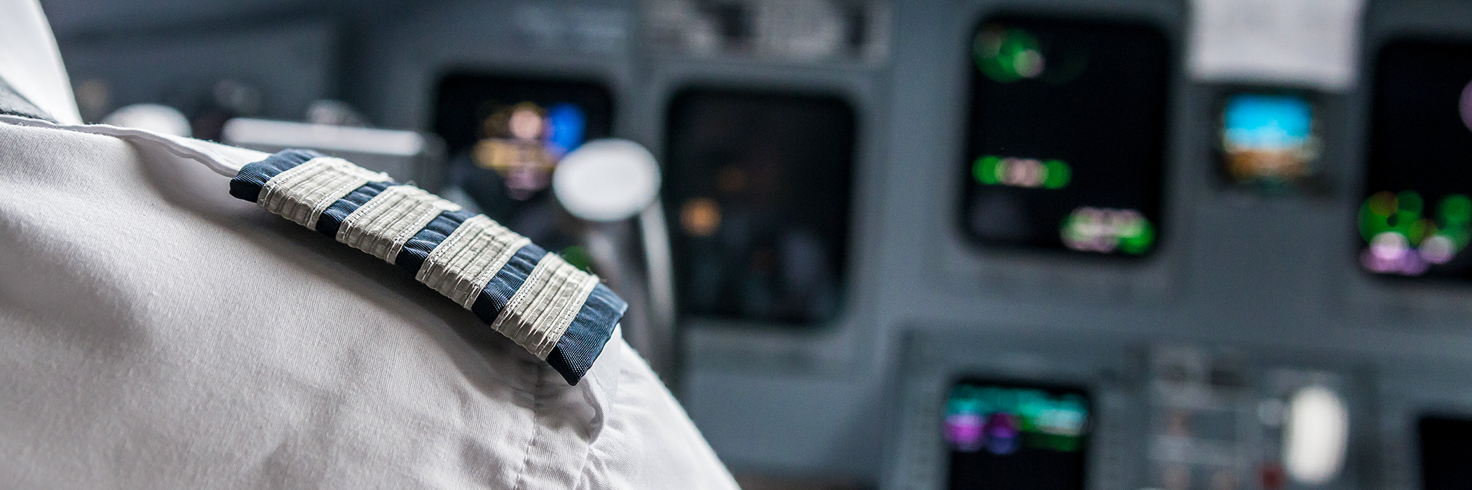 Pilot's epaulette with cockpit instruments in the background