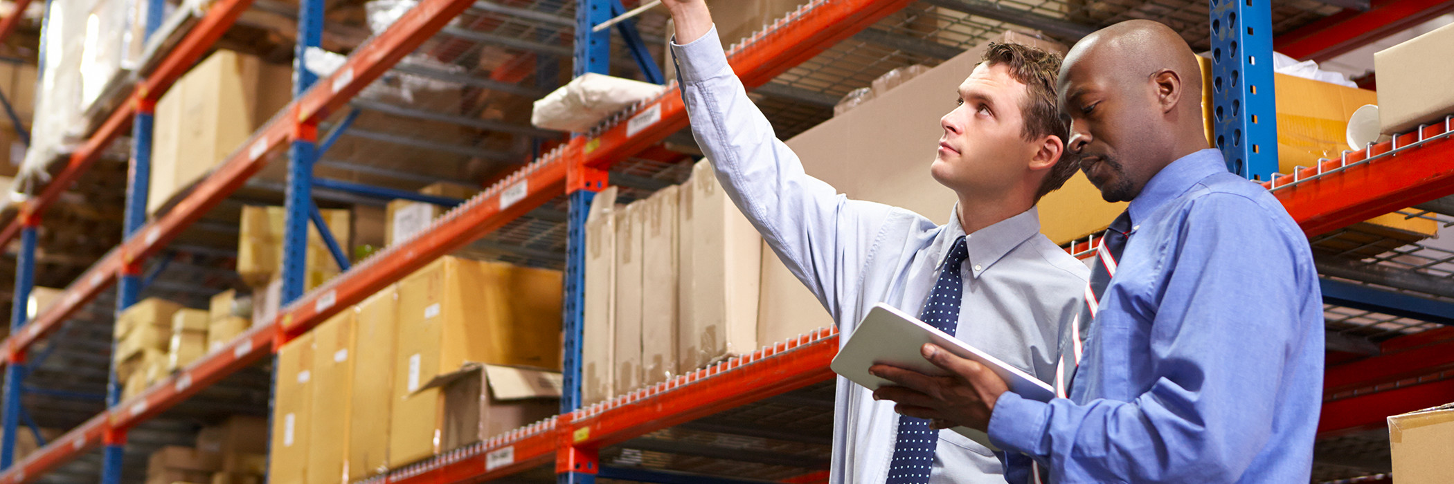 Businesspeople working in a warehouse