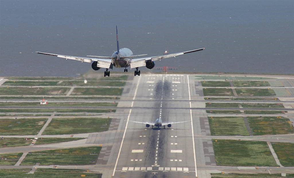 Planes landing on busy runway