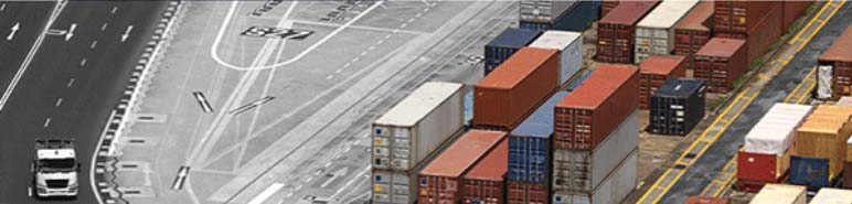 Shipping containers stacked in shipyard