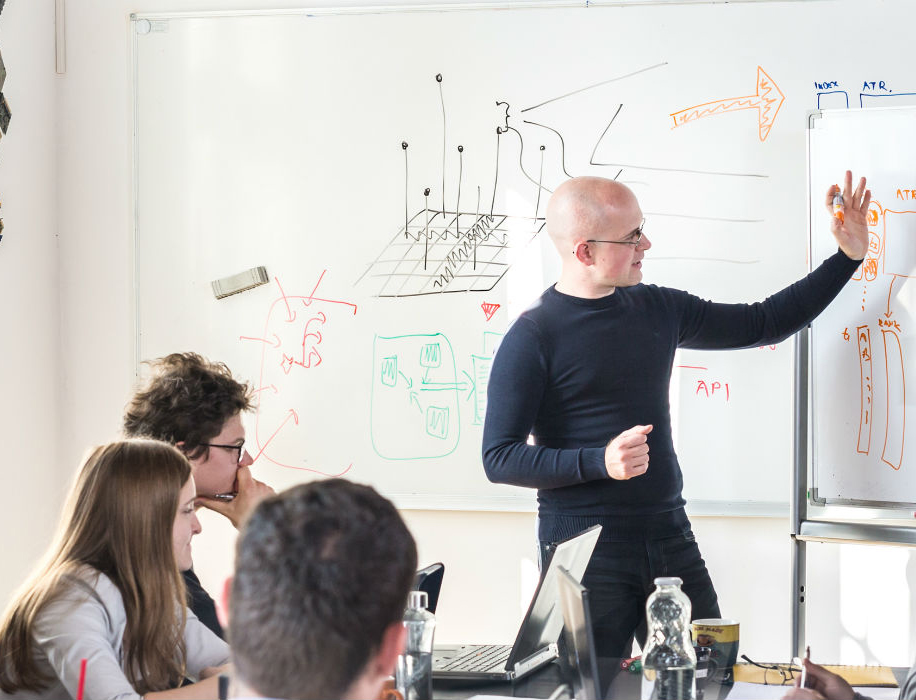 Man presenting ideas to group