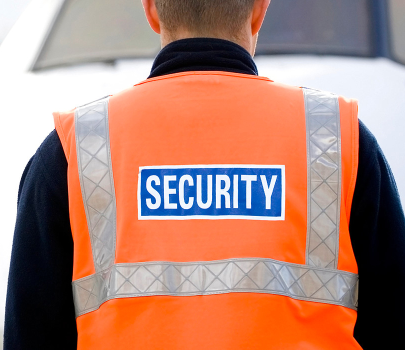 Airport officer in security vest
