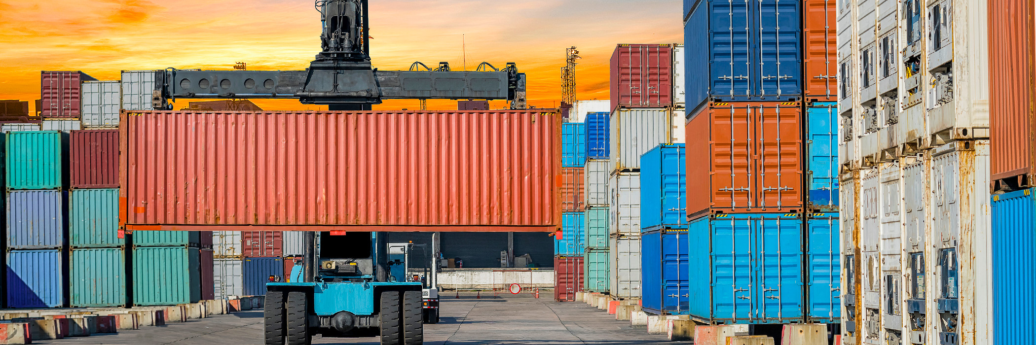 Shipping containers stacked in shipyard