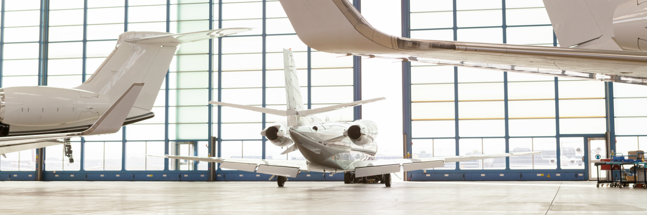 Private jets in fancy hangar