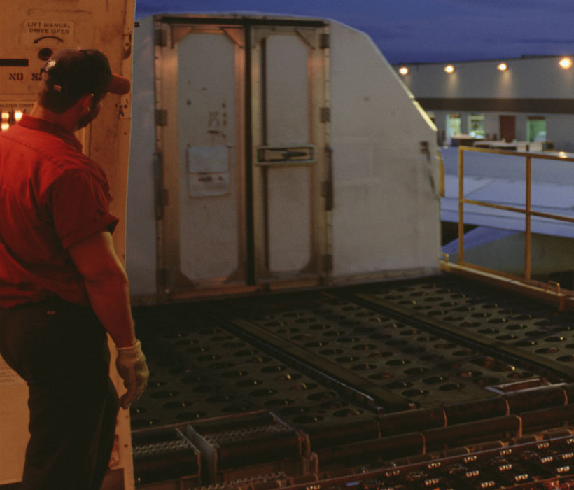 Freight operator standing at loading platform