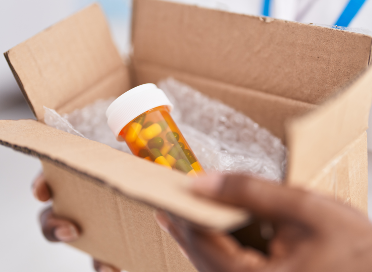 Box being opened with medications inside
