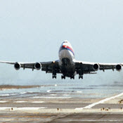 Airliner lifting off of runway