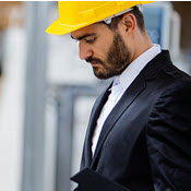 Man in suit and hard hat