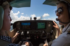 airline pilot reading a paper