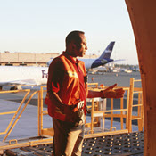 Cargo employee and empty cargo plane