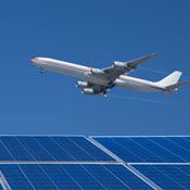 Jet flying over solar panels