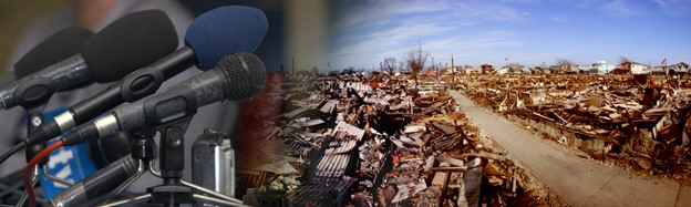 A bank of microphones next to a tornado torn community