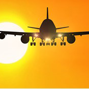Silhouette of Airplane flying into sun