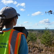 Drone pilot flying a quadrotor