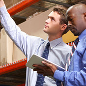 Businesspeople working in a warehouse