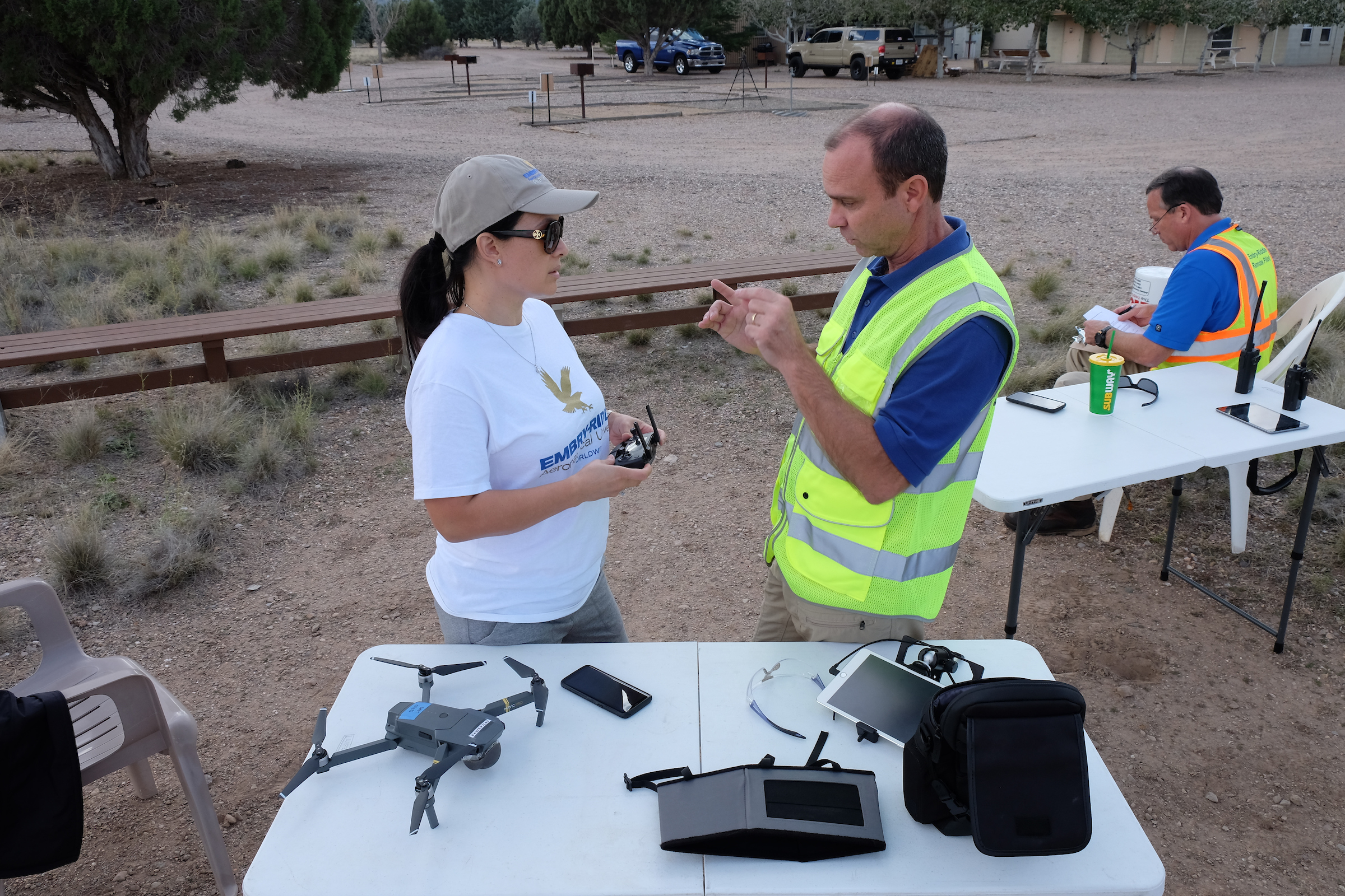 sUAS instructors and operator preparing for flight