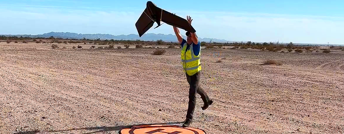 Drone pilot launching a fixed wing aircraft