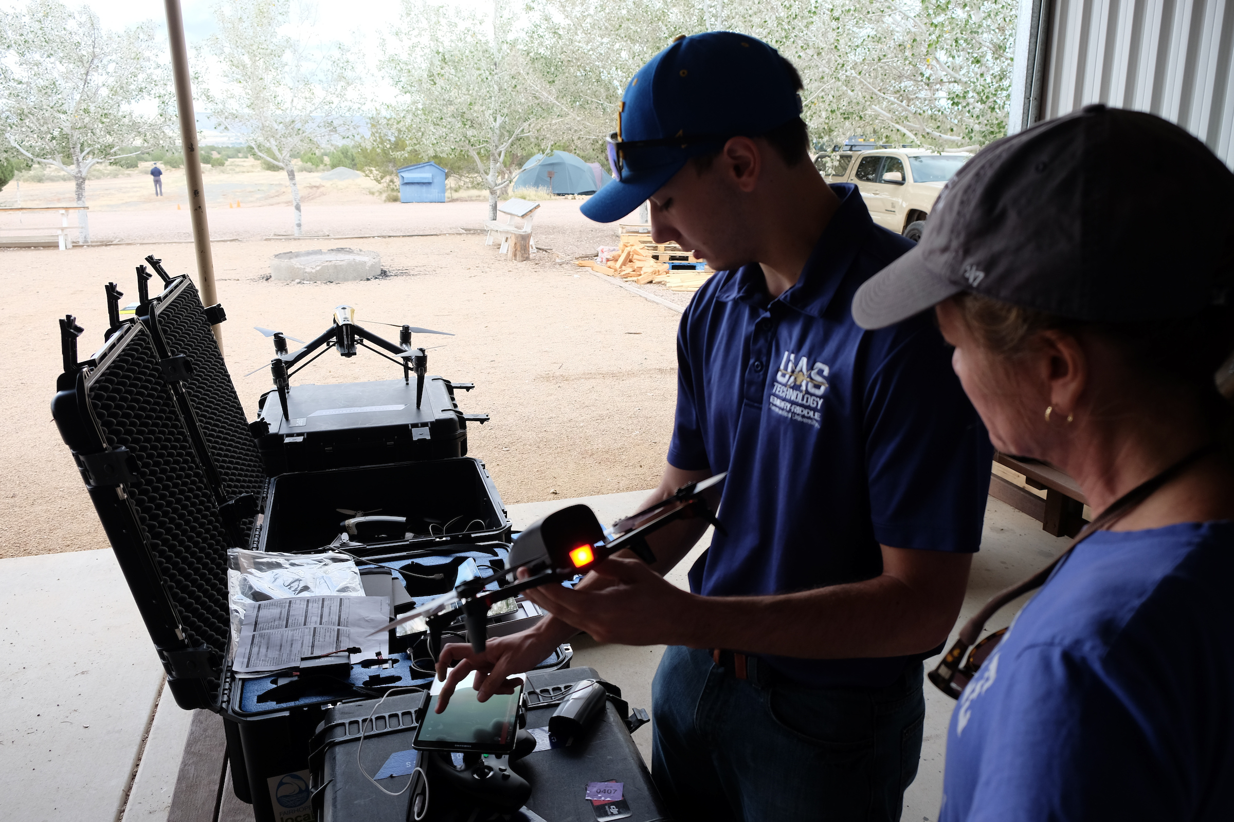 Two people inspecting sUAS