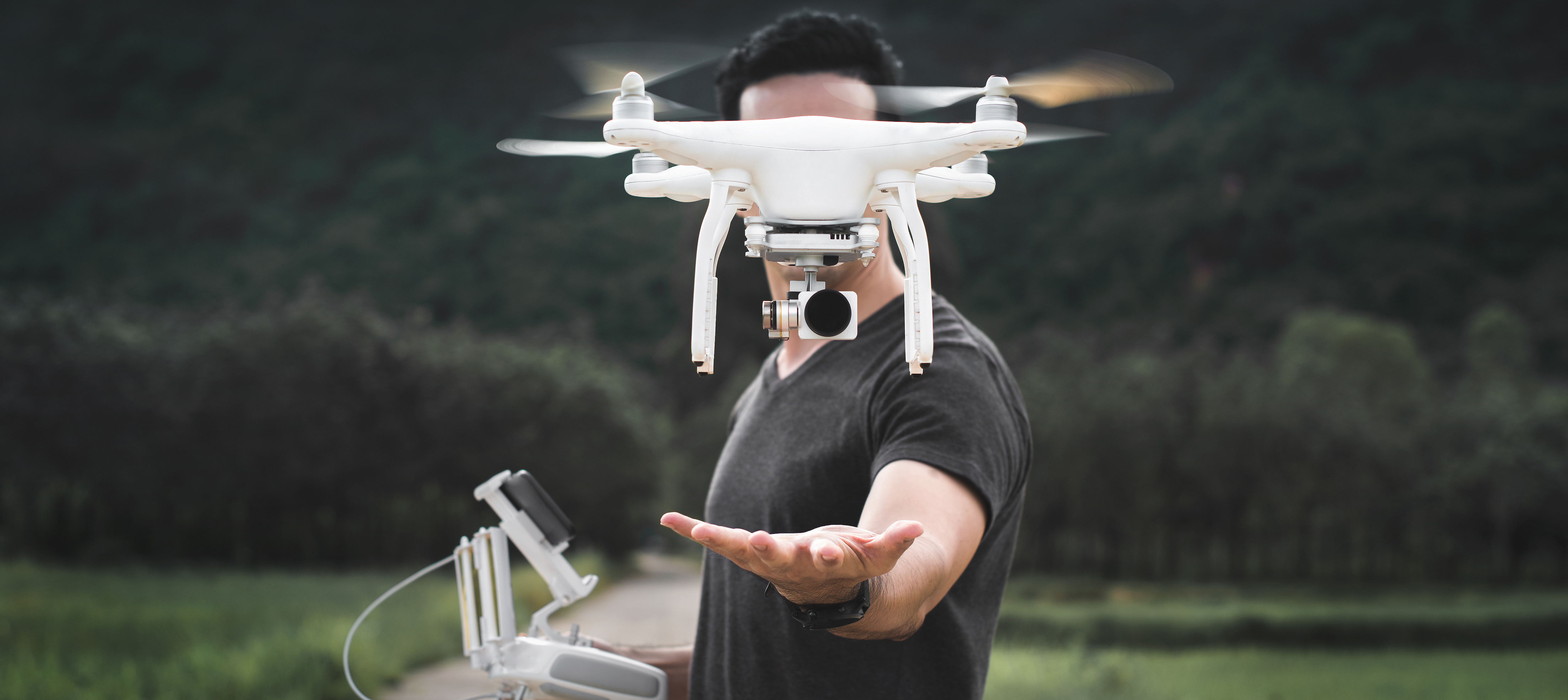 A man flies a drone