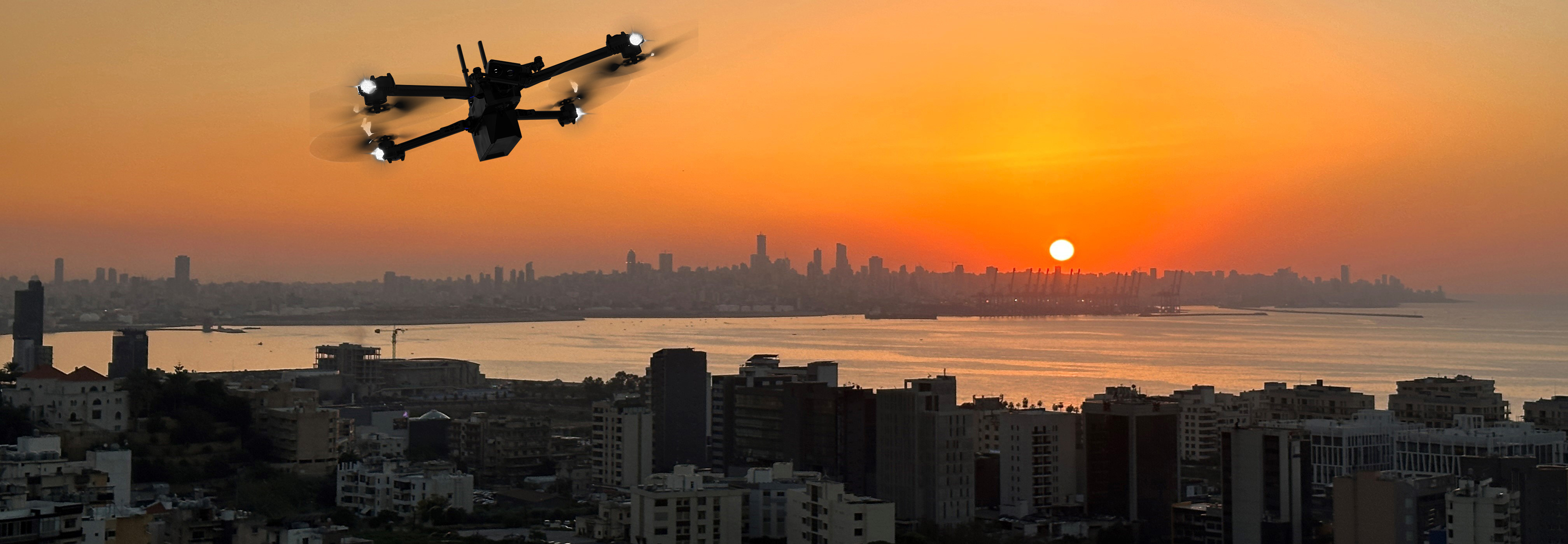 Drone flying over cityscape at dusk