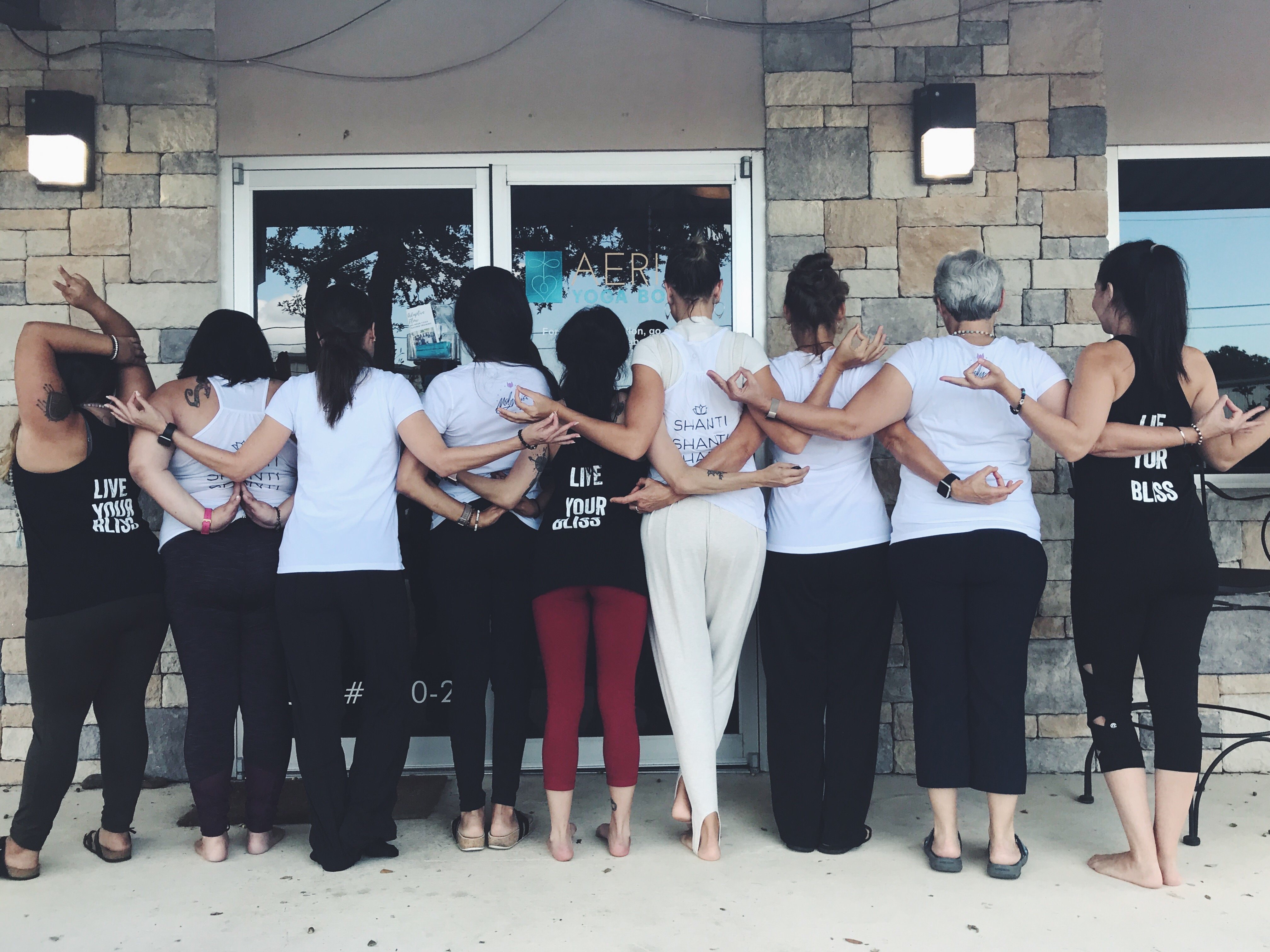 yoga class joining hands