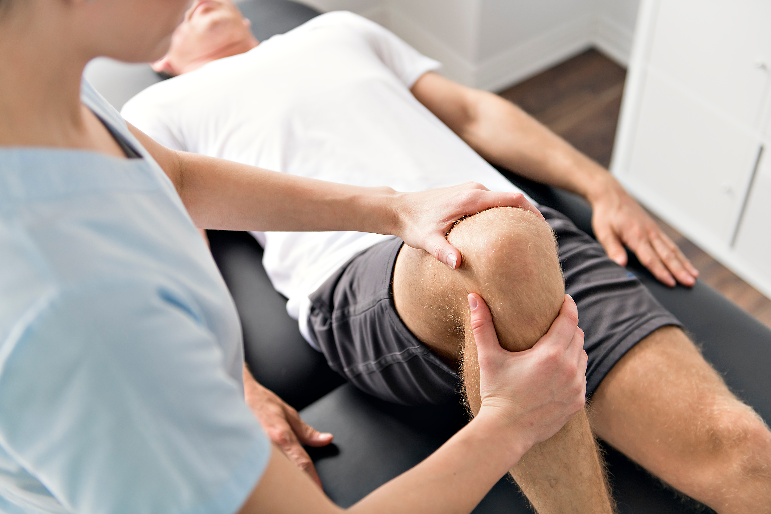 knee exam on chiropractic table