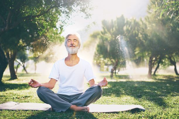Man meditating or doing yoga