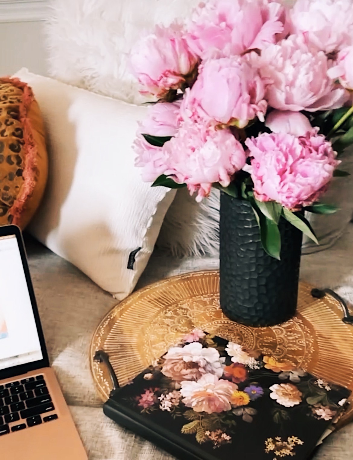 flowers next to a computer